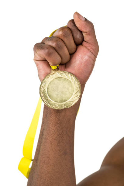 istock Athlete holding gold medal after victory 663533232