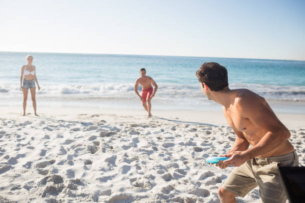 istock Friends playing with a frisbee 663569256