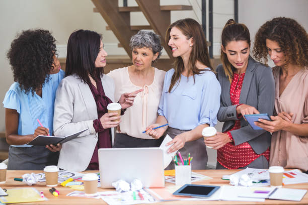 istock Group of interior designer interacting with each other 663569788