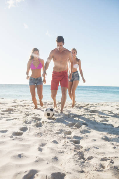 istock Friends playing football 663576906