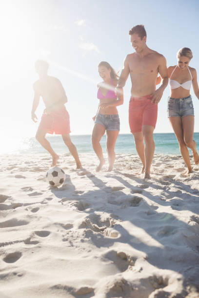 istock Friends playing football 663578614