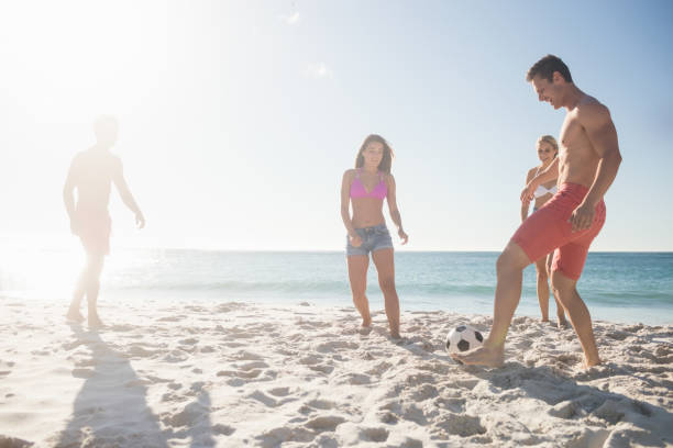 istock Friends playing football 663579828