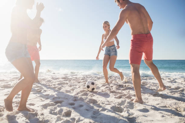 istock Friends playing football 663584690