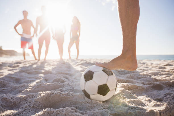 istock Friends playing football 663589328