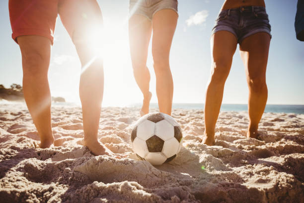 istock Friends playing football 663594524