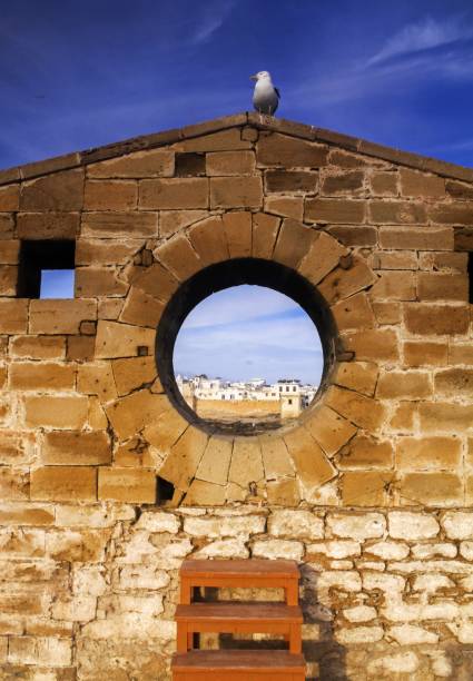 Porthole on old city walls in Essaouira Morroco looking towards old fishing harbor