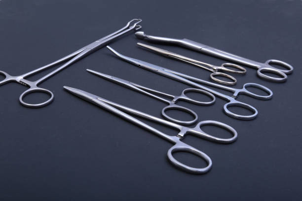 istock Medical and surgery instruments isolated in black mirror background 663622776