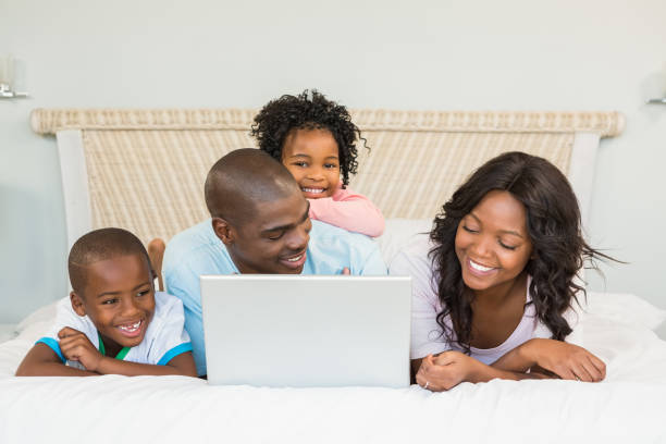 istock Family having fun together in bed 663623056
