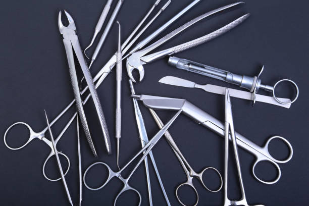 istock Medical and surgery instruments isolated in black mirror background 663623784