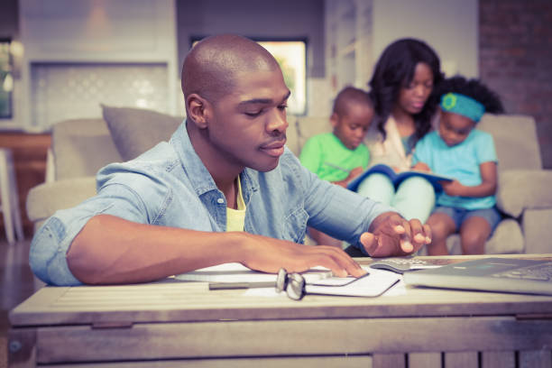 istock Man with bills and calculator 663652318