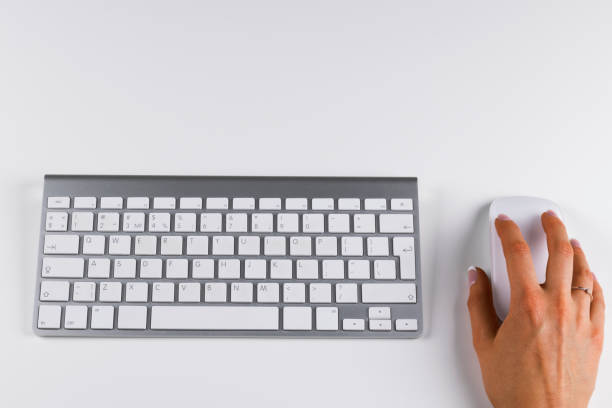 istock Closeup of businesswoman hand using wireless computer mouse and keyboard 663661560