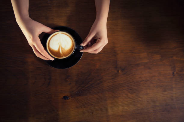istock Lonely woman drinking coffee in the morning 663671884