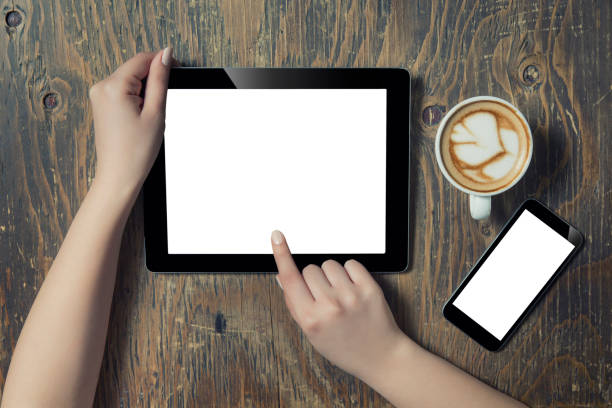 istock Hands holding Digital Tablet in a Coffee Shop 663672988