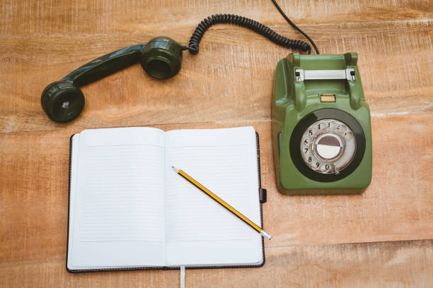 View of an old phone on wood desk