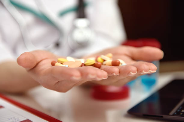 istock pills in female doctor hands 663700692
