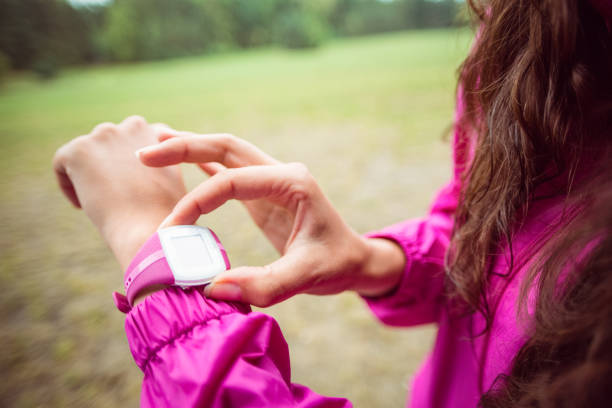 istock Woman using her smartwatch on a hike 663781148