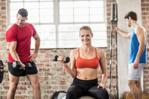 istock Fit people do some weightlifting together 663784996