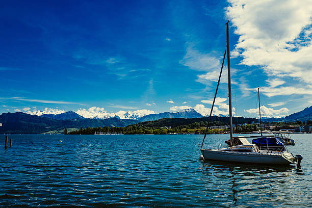 istock Boat In Sea With Mountain In Background 663785121