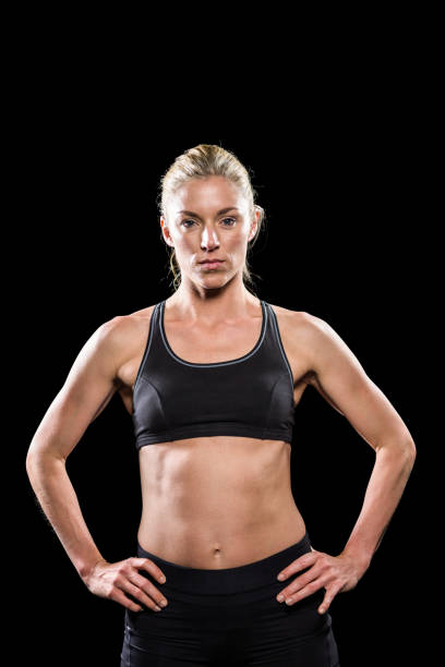 istock Female athlete standing with hand on hip 663787588
