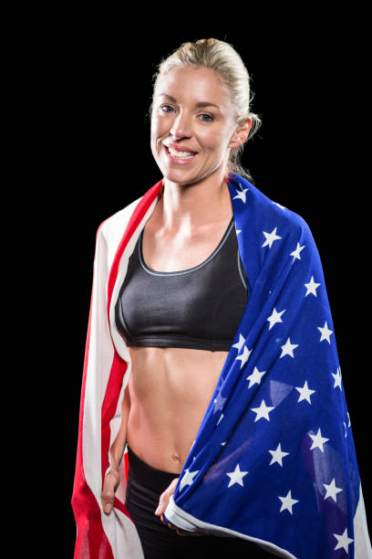 istock Athlete with american flag wrapped around his body 663787790
