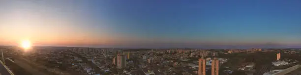 RIBEIRAO PRETO, SAO PAULO, BRAZIL -  Sundown at avenue and buildings in city - Panoramic view