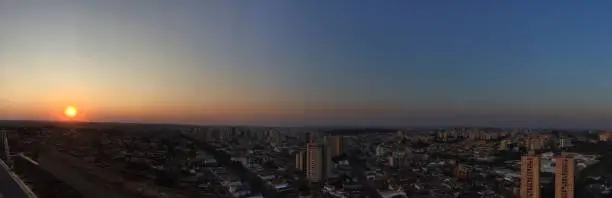 RIBEIRAO PRETO, SAO PAULO, BRAZIL -  Sundown at avenue and buildings in city - Panoramic view