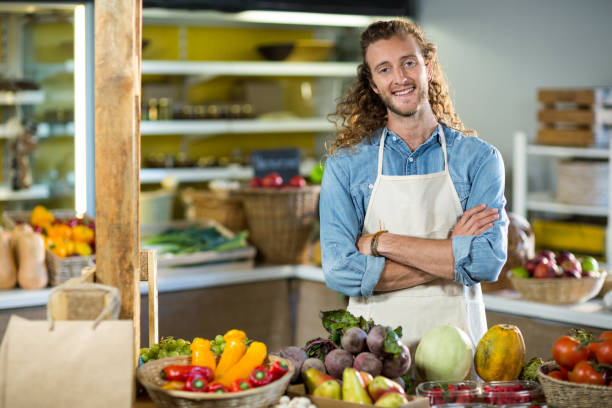 istock Vendor standing at the counter with arms crossed 663793762