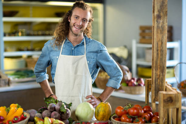 istock Vendor standing at the counter with hands on hips 663793808