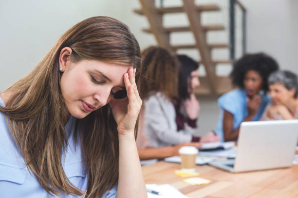 istock Tense businesswoman sitting in office 663799716