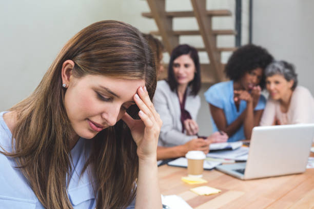 istock Tense businesswoman sitting in office 663799784