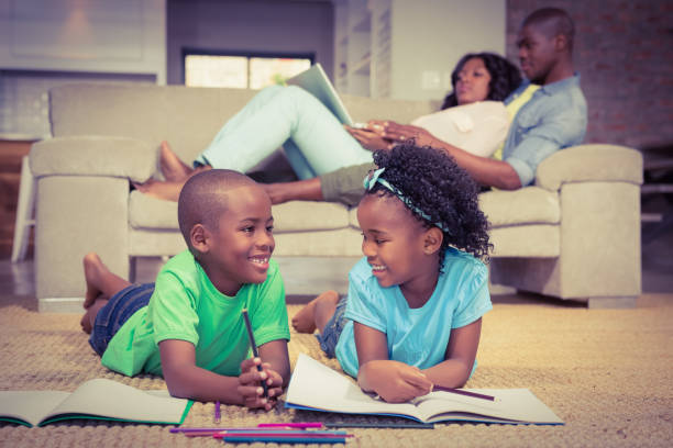 istock Happy siblings on the floor drawing 663799848