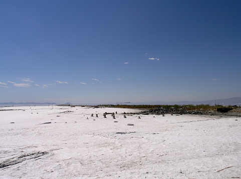 Salt field with bits of long forgotten industrial things visible in a remote area of Salt Lake, Utah