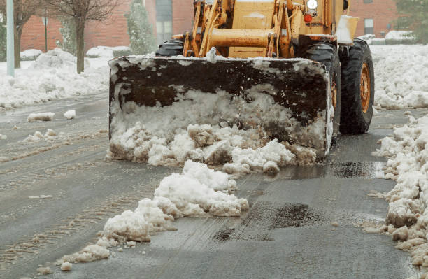 istock Snowplow removing snow from city road 663803364