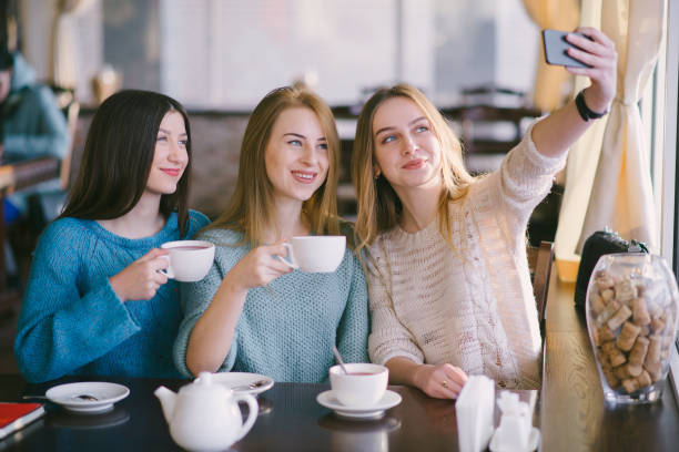istock girls in cafe 663806860