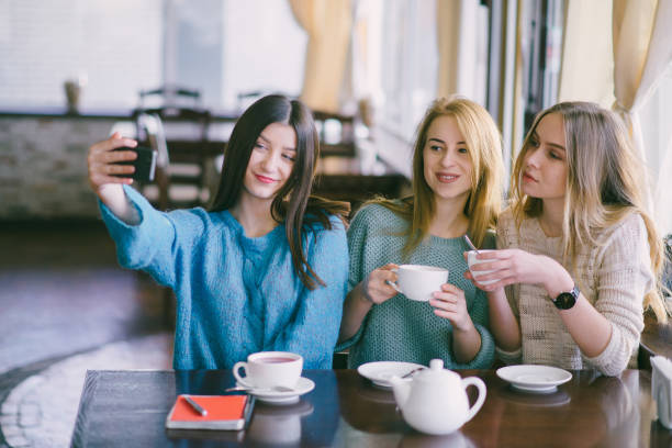 istock girls in cafe 663806874