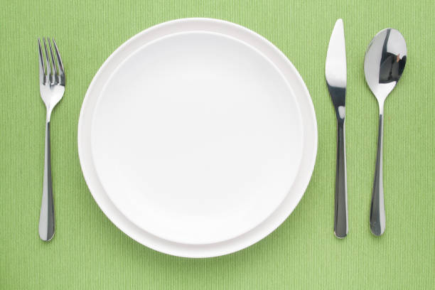 istock platein table knife and fork spoon on napery 663813644