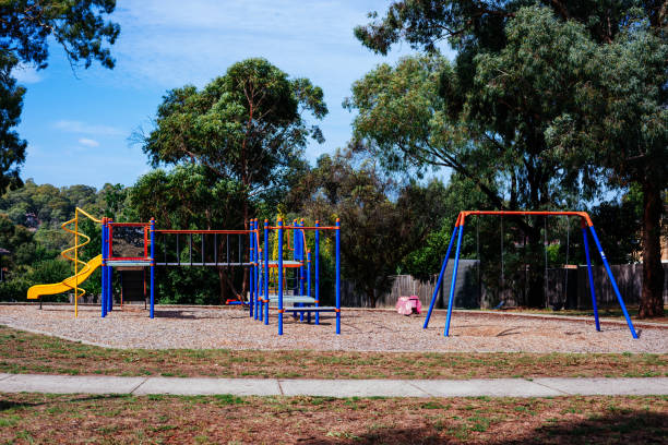 istock Empty colourful childrens playground in the park. 663820318