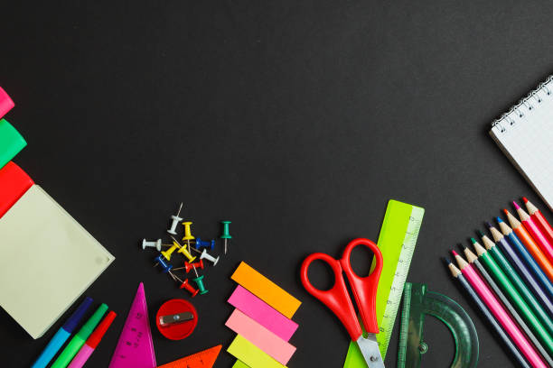 istock School supplies side border on a chalkboard background 663824412