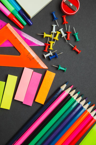 istock School supplies border on a chalkboard background 663824422