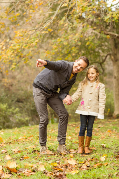 istock Happy father showing something to his daughter 663826756