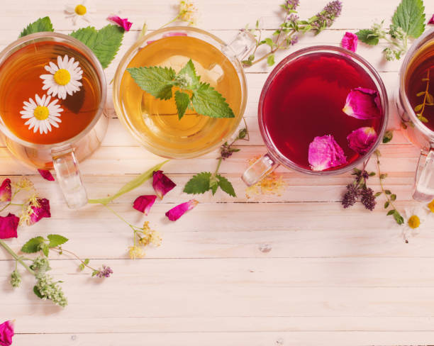 istock herbal tea on white wooden background 663826904