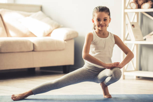 istock Little girl doing yoga 663827670