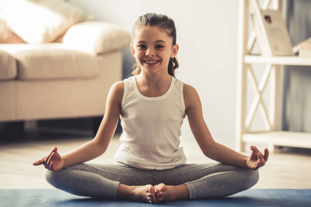 istock Little girl doing yoga 663827954