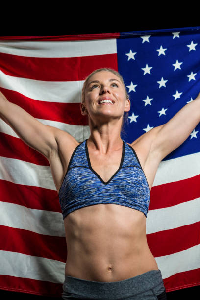 istock Athlete posing with american flag after victory 663827966