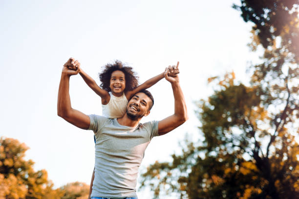 istock Happy father and child spending time outdoors and laughing 663827976