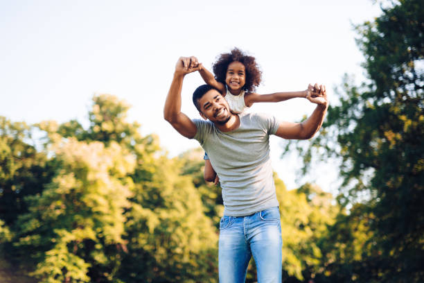 istock Happy father and child spending time outdoors and laughing 663827986