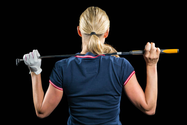 istock Rear view of golf player holding a golf club 663828250