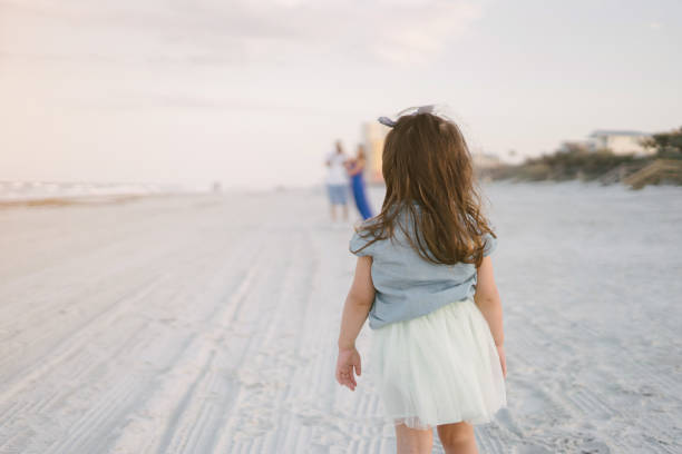 istock beautiful family on the beach 663828504