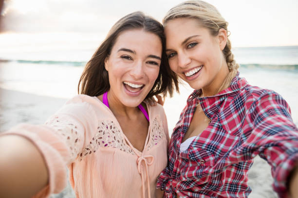 istock Smiling friends taking a selfie 663834344
