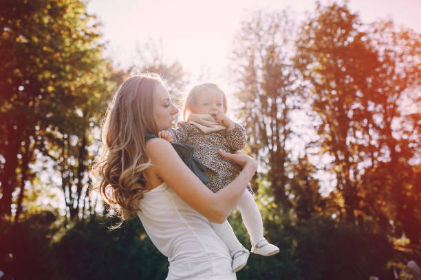 istock young family walking in the park 663834800
